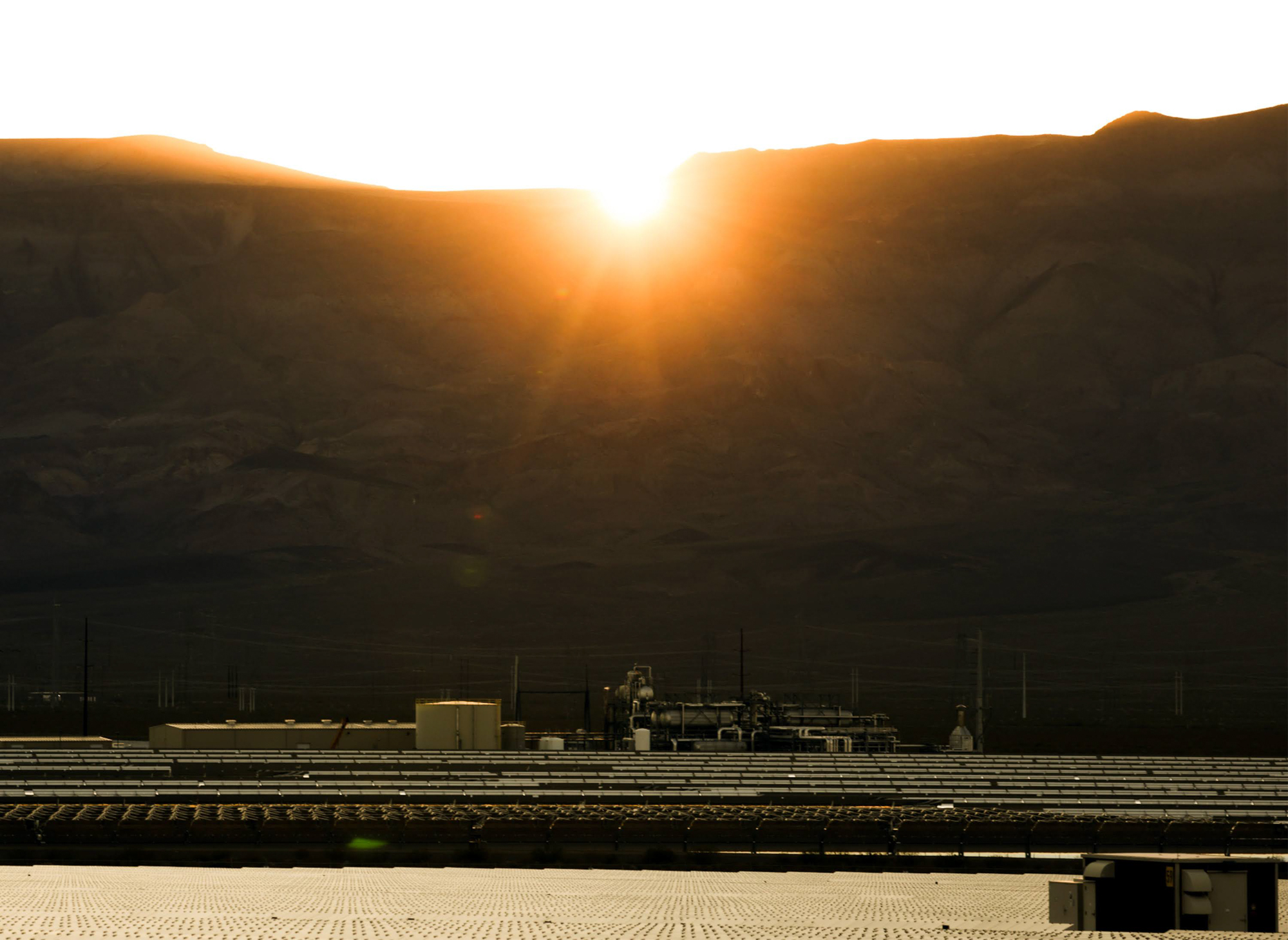 Sun sets over a solar field in Eldorado Valley south of Boulder City on Friday, July 20, 2023. (Jeff Scheid/The Nevada Independent)